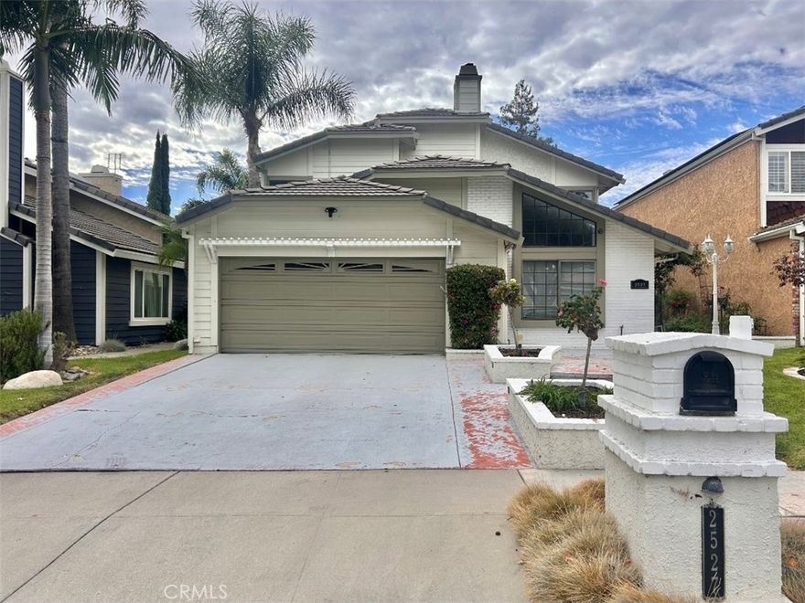 Welcome to this beautifully upgraded two-story home, tucked away on a peaceful cul-de-sac in a desirable Simi Valley neighborhood. Step through the front door and you are immediately greeted with an open, airy floor plan. To your left is the spacious living room with soaring ceilings and a dramatic triangular window that fills the space with natural light. To your right, the formal dining room provides the perfect setting for family gatherings and entertaining. Straight ahead, the comfortable carpeted staircase anchors the center of the home. Just before the stairs, you’ll find a convenient powder room and two additional storage closets along the wall. To the right of the dining room, the chef’s kitchen features custom cabinetry, a built-in refrigerator, professional-grade stove and oven, ample storage, and a breakfast nook. The breakfast area is enhanced by brand-new French doors that open out to the inviting backyard. The backyard has been thoughtfully designed for entertaining, with high-quality artificial turf, multiple seating areas, roses, fruit trees, and charming string lights that create a warm and welcoming ambiance in the evenings. Past the breakfast nook, with its own sliding door access from the backyard is a versatile multi-purpose room with new flooring—ideal for a playroom, office, or media space. Just off this area, the laundry room provides direct access to the two-car garage. Upstairs, the expansive primary suite sits to the right, boasting a thoughtfully redesigned spacious spa-like bathroom with a large tiled rain shower, dual sinks, and a custom walk-in closet with drawers, shelves, and hanging space for every need. To the left of the stairs are two additional bedrooms, each filled with natural light, and a beautifully upgraded secondary bathroom with double sinks and a walk-in shower. The landing area offers both a linen cabinet and an additional built-in cabinet with shelving, providing plenty of storage.

With solar panels for efficiency, stylish updates throughout, and an inviting flow designed for comfort and entertaining, this home is the perfect blend of modern convenience and timeless charm—close to schools, parks, shopping, and easy commuter access.