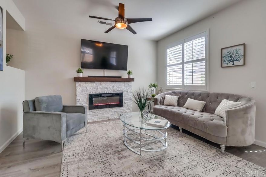 This beautiful move-in ready home, Solar system! AC included, offers 4 bedrooms, 2.5 bathrooms, an OPEN floor plan, 2 car garage, an upstairs laundry room, Master Bedroom walk-in closet, Master en-suite bathtub, shower and dual vanity sinks. The home also features vinyl flooring, quartz countertops, window shutters downstairs, stainless steel appliances, quartz kitchen island, recessed lighting, ceiling fans with remotes in each bedroom, and a tankless water heater. .Nestled in a welcoming community ideal for new homeowners” and have the luxurious perks of access to the parks through out the community. Conveniently located near highly Top rated schools. A perfect combination of home & community. DON'T MISS THIS OPPORTUNITY.