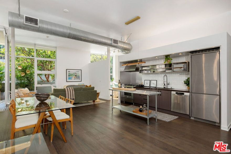 Modern Loft Living in the Heart of the Marina Arts District!  Welcome to Gallery Lofts where clean, modern design meets the creative energy of one of Marina del Rey's most vibrant neighborhoods. This stunning 2-bedroom, 2-bathroom ground-floor unit offers nearly 11-foot ceilings, expansive floor-to-ceiling windows, and oversized Fleetwood sliding doors that flood the space with natural light and create seamless indoor-outdoor flow to a private ~280 SF balcony lined with lush palms.  Designed with a contemporary open-concept layout, the sleek kitchen features stainless steel appliances, while the oversized primary suite boasts a custom walk-in closet and a luxurious bath with soaking tub and separate glass shower.                                                                                                                                     Additional highlights include:                                                                                                                               *Hardwood flooring                                                                                                                                                                *Central A/C & heat                                                                                                                                             *Upgraded shower fixtures in primary bath                                                                                                                            *Closest systems                                                                                                                                                                              *Brand NEW water heater                                                                                                                                               *In-unit laundry                                                                                                                                                                                         *2-car parking & ample guest parking                                                                                                                                                                                                                                           Gallery Lofts offers residents a peaceful, artfully landscaped community with a serene outdoor lounge, BBQs, and a double-sided fireplace  perfect for entertaining or unwinding.All of this just minutes from Abbot Kinney, Playa Vista, the beach, bike paths, shops, restaurants, theaters, grocery stores, and everything Marina del Rey has to offer!                                                                                                                       **Developer quoted approx. 1,340 SF; LA County Assessor shows 1,260 SF**
