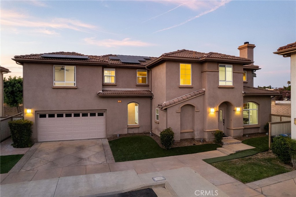 Nestled within an exclusive gated enclave of just twelve homes, this 2010-built residence offers space, function, and privacy in a serene setting that feels worlds away from the activity of the San Fernando Valley. The home features an open-concept floorplan with a spacious dining area that flows effortlessly into the kitchen—ideal for both everyday living and entertaining. A main-level bedroom and bath provide flexibility for guests or multigenerational needs.
Upstairs, large secondary bedrooms complement a generously sized primary suite with dual sinks, a soaking tub, and a walk-in closet. A dedicated laundry room is also conveniently located on the upper level.
The backyard is expansive with true pool potential, while a low-maintenance turf yard enhances everyday ease. The property includes a leased solar system, supporting energy efficiency.
Situated just minutes from the 118 and 101 freeways, this location offers quick access to premier shopping and dining at The Village and Westfield Topanga, as well as proximity to the new Rams facility. Families will appreciate inclusion in the boundaries of Ernest Lawrence Magnet Middle School and Chatsworth Charter High School, along with easy access to acclaimed private schools such as Chaminade and Sierra Canyon.
Low HOA dues and a quiet, well-maintained community complete this outstanding offering.