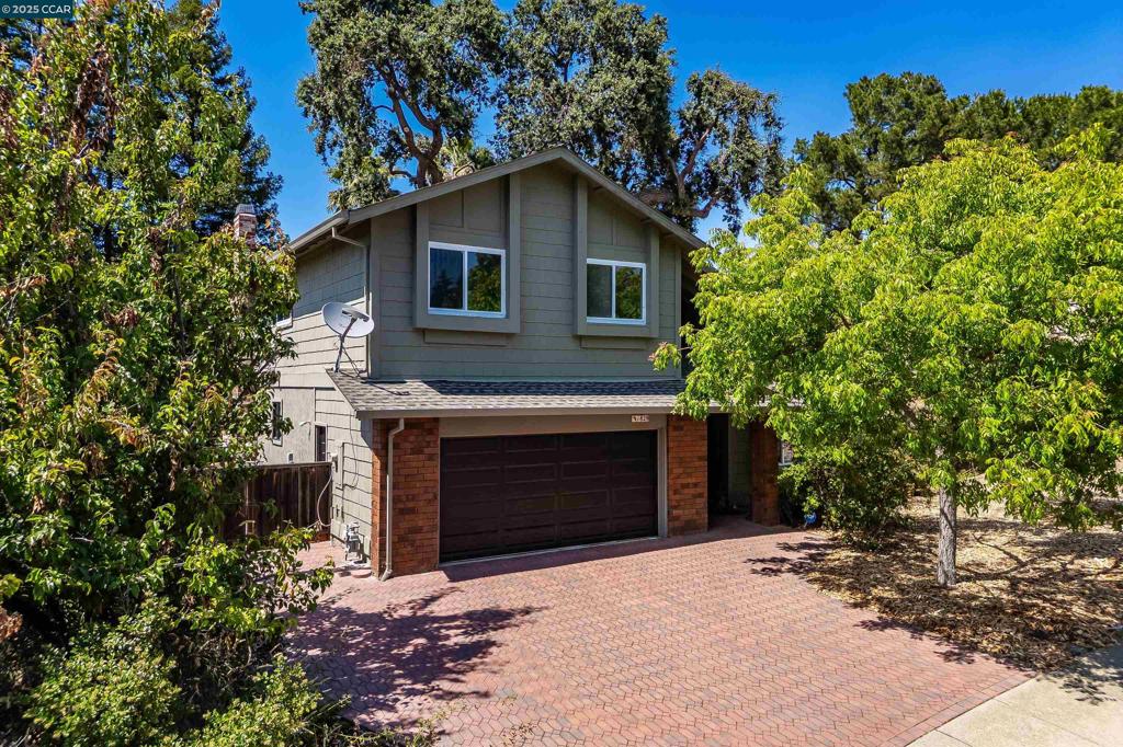Step into comfort, charm, and convenience at this freshly painted, beautifully maintained 4-bedroom home nestled in a quiet, sought-after Clayton neighborhood. From the moment you walk through the door, you’re welcomed by soaring ceilings, natural light, and a flowing open layout perfect for entertaining or everyday living. The newly remodeled kitchen features stainless steel appliances including a double oven, refrigerator, and dishwasher plus ample cabinetry, a breakfast bar, and a window overlooking the expansive backyard. Off the kitchen, a cozy dining nook and inviting family room with fireplace lead to a spacious yard through sliding glass doors. Relax or host gatherings on the deck beneath a majestic Heritage Oak, or explore the potential for a pool, sport court, RV access, or even an ADU in the generous side yard and large lot. Upstairs, you'll find four spacious bedrooms, including a serene primary suite with a newly updated private bath and large closet. All of this is just minutes from charming downtown Clayton, top-rated schools, scenic hiking trails, parks, and local dining. Come experience the lifestyle that Yolanda Circle has to offer. This is the kind of home that feels right the moment you walk in!