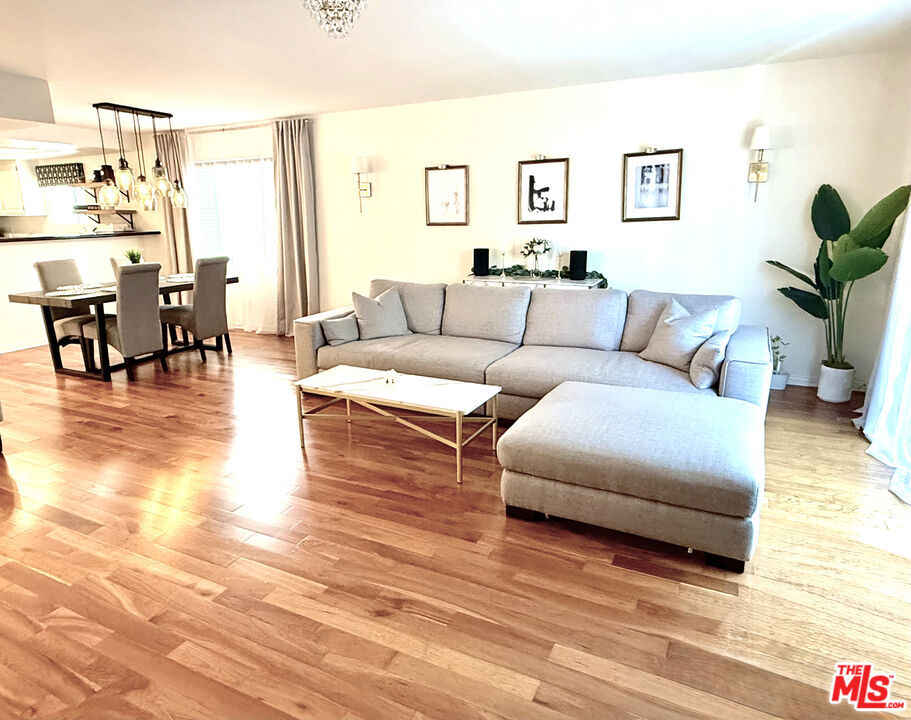 Welcome to 11907 Darlington Ave #101, a beautifully updated front-facing condo located in a well-maintained 9-unit building in the heart of Brentwood. This bright and spacious 2-bedroom, 2.5-bath home offers over 1,350 square feet of comfortable living space with great natural light and an open floor plan.The living room features a cozy gas fireplace and opens to a sunny southwest-facing balcony perfect for relaxing or entertaining. The kitchen has been tastefully remodeled with updated cabinets, shelving, and plenty of counter space, and flows nicely into the dining area. Both bedrooms are ensuite and well-sized, with the primary suite offering a walk-in closet and a nicely updated bathroom.Additional highlights include in-unit laundry, central air and heat, recessed lighting, hardwood floors, and two tandem parking spaces in a secure gated garage, plus extra storage.Located just minutes from Brentwood's shops, restaurants, and cafes, this move-in-ready home is a fantastic opportunity to enjoy Westside living in a quiet, desirable neighborhood.