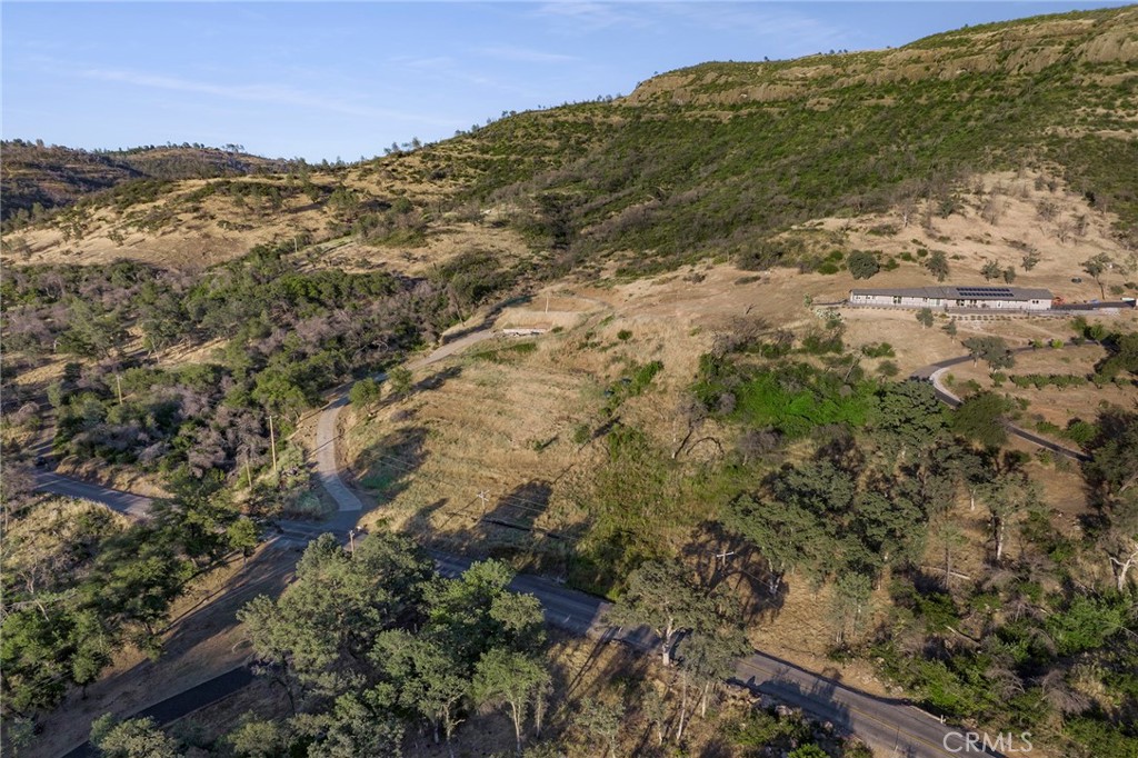 AWESOME CLEARED 5.03 ACRE LOT WITH STUNNING VIEWS OVER LOOKING BUTTE CREEK CANYON AND THE VALLEY. PROPERTY HAD 2 HOMES TOTALLing 4151 SQFT, TWO SEPTIC TANKS. HAS A WELL AS WELL AS A NATURAL SPRING TOWARDS TOP OF PROPERTY WAS USED AS A GRAVITY FEED WATER SYSTEM BY PRIOR OWNER. HOLDING TANKS HAVE BEEN REMOVED AS PART OF DEBRIS CLEAN UP BUT CONCRETE PADS FOR WATER TANKS ARE
STILL IN PLACE. PAVED DRIVEWAY IS STILL IN PLACE. FOUNDATION FROM ONE HOME IS STILL IN PLACE. BEAUTIFUL AND PRIVATE YET CLOSE
TO CHICO AND PARADISE. GRAPES and BERRIES LOVE THE SOIL AND IT'S SLOPES--HOBBY VINYARD PERHAPS? NO STRUCTURES REMAIN ON THE PROPERTY. THE SEPTIC AND WELL INSPECTION AND TEST ARE ON FILE FROM A YEAR OR SO AGO.