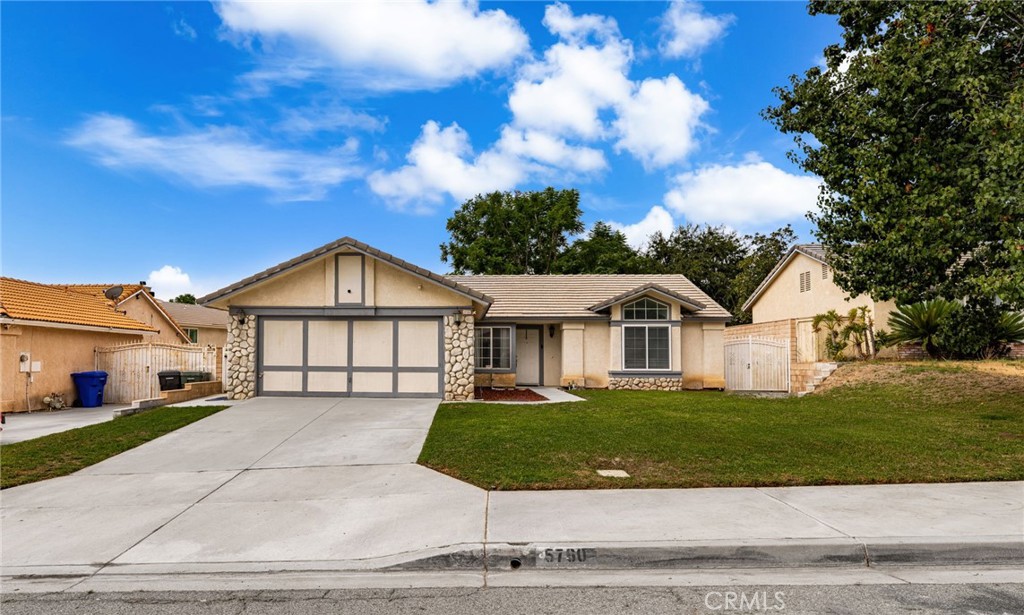 Welcome to this charming single-level home in San Bernardino’s desirable north-end, where beautiful mountain views frame a peaceful neighborhood setting. Step inside to vaulted ceilings and a spacious living room accented by a mantled stone fireplace and sliding doors that open to the backyard, blending indoor comfort with outdoor living.
The home features an open kitchen concept with a cozy dining area designed for connection and convenience. You’ll find attractive cabinetry, a stainless sink, flush-mount lighting, and a sit-up breakfast bar. Best of all, it’s waiting for your personalized touches and selection of countertops and finishes — the perfect opportunity to make it truly your own.
Plank-style flooring adds a stylish, low-maintenance touch throughout. The primary suite features a private bathroom, complemented by two additional bedrooms — one with double doors that can easily serve as a home office or hobby space.
Outside, the fenced backyard is ideal for entertaining, complete with a covered patio and plenty of room to play. With a two-car garage, central air, and a convenient location near schools, freeways, and shopping, this home combines comfort, flexibility, and potential in one inviting package.