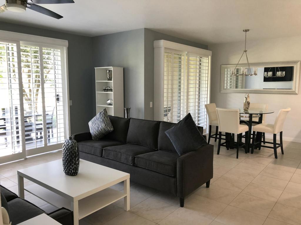 Get ready to fall in love with this vibrant, upgraded ground-level condo perfectly positioned on the 5th fairway of the Nicklaus Tournament Course--home of the American Express Golf Tournament! Enjoy front-row seating for the action and soak in jaw-dropping western mountain and fairway views right from your private back patio.This 3-bedroom, 2-bath gem is full of energy and style, featuring fresh modern paint, granite countertops in the kitchen and baths, plantation shutters, ceiling fans, and a newer HVAC system to keep things cool year-round.Whether you're hosting guests or enjoying a quiet morning coffee, this space is built for the ultimate desert lifestyle.Includes a spacious 2-car detached garage with plenty of room. Just mere steps to one of the many pools & spas. Offered fully furnished, it's truly move-in ready--just bring your toothbrush!Don't miss this rare opportunity to own a slice of golf course paradise!