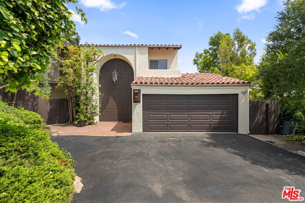 Elevated Privacy Meets Breezy Brentwood Living! Tucked into a peaceful corner lot in sought-after Brentwood Hills, 2492 Banyan Drive offers the best of relaxed California living in a beautifully refreshed two-story contemporary home. With 4spacious bedrooms, 2.5 baths, and tranquil outdoor spaces, this inviting residence is the perfect private retreat just moments from the heart of Brentwood. Step inside to discover an open floor plan filled with natural light, where Saltillo tile floors, two cozy fireplaces, and fresh interior paint create warmth and character throughout. The remodeledkitchen features sleek stainless steel appliances and opens to a cool, shaded patioideal fordining al fresco or morning coffee in the garden. The expansive living and dining areas seamlessly connect to a lush grassy yard and look out over serene canyon vistas, with even a peek-a-boo ocean view from the second level. Upstairs, a bright staircase leads to four well-sized bedrooms. Three guest rooms share a large bath with double vanity, while the private primary suite offers its own fireplace, a remodeled en-suite bathroom, and generous closet space. Additional features include new plush carpeting upstairs, ample storage, and a true sense ofpeace and privacyall on a corner lot in one of LA's most desirable neighborhoods. Available immediately for a 1+ year lease, this is your chance to experience the best of Brentwood Hills in a home that blends comfort, charm, and quiet sophistication.