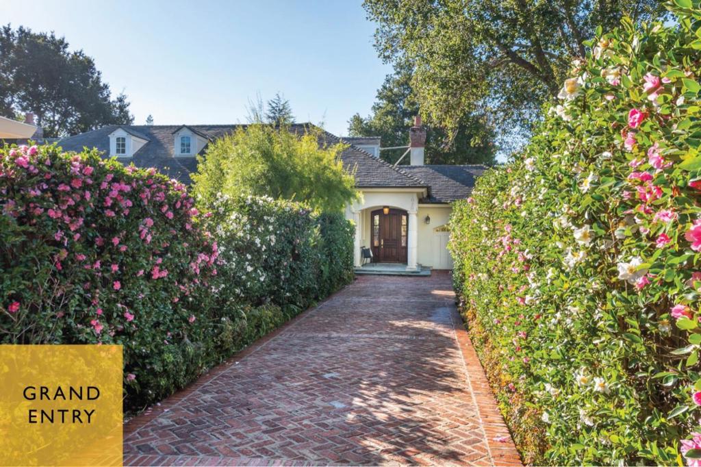Secluded home on private herringbone brick driveway embraced by walls of Camellias // Uncommonly well-crafted with extensive built-ins, casework, and detailing such as groin vaulted primary suite // Guest Bedroom (possible office) and Primary Suite on ground floor // Two Bedrooms (formerly three) and Two Baths on second floor // Al fresco dining in verdant setting with fountains, many trees, ferns, and more // Mere steps to downtown amenities; 4 blocks to Addison ES; 3 blocks to Eleanor Pardee Park; and a 5 min drive to Caltrain Station //