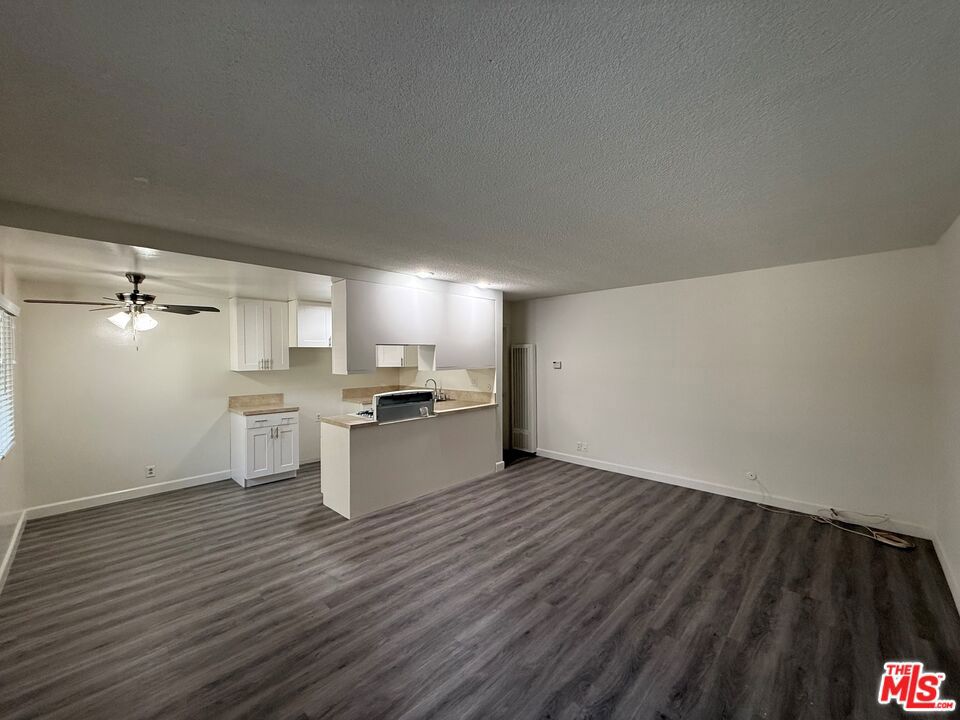Beautifully remodeled 1 bedroom - 1 unit where kitchen has been renovated with new kitchen cabinets, new stove/oven and sink. Large living and dining room with new laminate flooring throughout . Bathroom has also been redone. There is one parking spot at gated carport, gated building, community pool and laundry room. Property has on-site resident manager for quick response to maintenance issues.