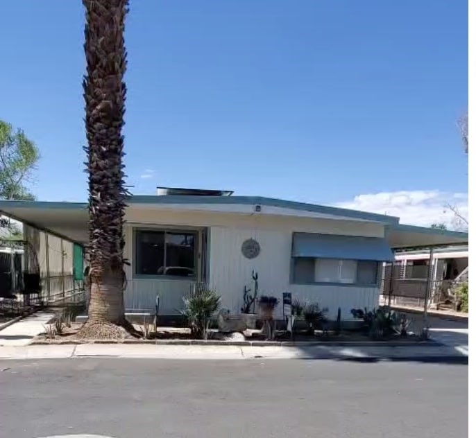 Come experience this classy very active 55+ adult social community country club amenities at a fraction of the expense. This Manufactured Home with upgraded 2 Bedrooms plus a Bonus flex room to meet your needs as office/den. This guard gated community is close to all amenities including shopping, casinos and easy freeway access! Close to Agua Caliente Casino between Palm Springs and Rancho Mirage it features an 18-hole executive golf course, Nick's Bistro with casual dining, multiple pools, spa/sauna, exercise room, tennis and pickleball courts and dog park. The spacious clubhouse features many social events and organized activities held by the community. This home features an open floor-plan. Huge living and dining area with built in buffet storage. The kitchen features newer appliances. Recent upgrades include vinyl flooring throughout with upgraded sub-flooring, energy efficient DRYWALL for climate control and sound barrier and new paint. Abundant storage. Inside laundry with plenty of cabinet space! Primary retreat features ensuite bath. Both baths feature vessel sinks and newer shower enclosures with bidet conversions to the toilets no more toilet paper . Primary bath features a newer vanity. Included are Newer Stovetop gas oven Range, A double door fridge auto Ice maker, and a great Baby Grand Family heirloom Piano.
The Energy efficient SUNRUN solar panels pretty much wipes out your electric bills every month., a tankless newer water heater and ceiling fans provide superior efficiency. Other spectacular features include a covered carport which can accommodate 3 vehicles. 2 covered screen-in enclosed side patios offer privacy, and a large rear yard is waiting for pets or your landscape touch. The front features a desert low maintenance landscape and A large tool shed adds storage to the yard.