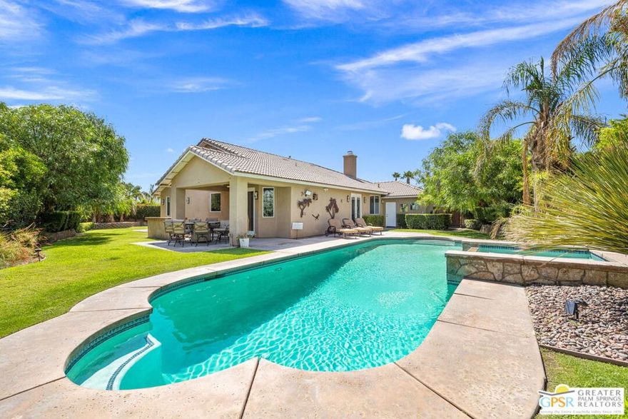 Tucked away on a spacious cul-de-sac in the Bermuda Vista community, this beautifully upgraded single-story home is ready to welcome your family, whether you're looking for a fully furnished move-in or prefer to bring your own touch. With four bedrooms, three bathrooms, and over 2,300 square feet of thoughtfully designed living space, this home offers the perfect blend of comfort, style, and flexibility. Inside, you'll find a formal entry, a dedicated dining room for special gatherings, and a generous living area with a cozy fireplace and media niche. The kitchen is a dream for home cooks and entertainers alike, featuring an oversized island, granite countertops, bar seating, and direct access to the side yard for effortless indoor-outdoor living. Crown molding, tile flooring, and custom finishes add warmth and character throughout. The layout is ideal for families, with a private ensuite in one of the secondary bedrooms and a spacious primary suite that opens to the patio, complete with a walk-in closet, soaking tub, and dual vanities. Whether you're working from home, raising kids, or welcoming guests, this home adapts to your lifestyle. Step outside to your desert oasis complete with a lush, wraparound yard, a sparkling pool and spa with waterfall features, and ample space for entertaining or simply relaxing in the sun. A three-car garage and an extended driveway provide generous parking and storage for family and guests alike. Located just minutes from top-rated schools, golf courses, shopping, dining, Acrisure Arena, and the best of the desert's seasonal events, this is a rare opportunity to live in one of the area's most sought-after neighborhoods on your terms, furnished or unfurnished.