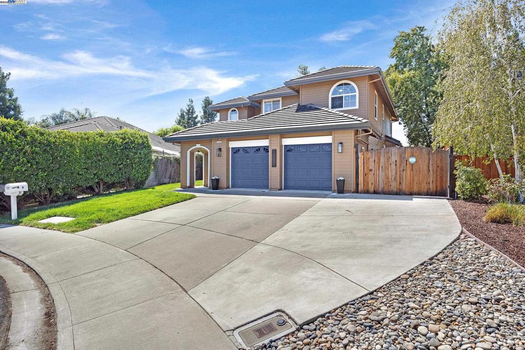 Open house 9/6 and 9/7 2-4. Private street. Beautiful 4 bedroom 3 full bath home with a bedroom /bathroom downstairs. Laminate floor throughout downstairs. Formal dining area with bay window. Spacious kitchen features stainless steel appliances, gas range, built in microwave and oven, double door refrigerator, dishwasher and granite counters. Lot’s of cabinets and breakfast bar. Gas fireplace in family room. Lot’s of natural light. Downstairs bath has double stall shower. Large laundry room with washer, dryer and laundry sink. Primary suite is spacious. Walk in closet with mirrored doors and built in closet organizers. Primary bath has a shower, oval tub and 2 sinks with new laminate flooring. Large 3rd bedroom has been set up as an office. Good sized 4th bedroom. Large, nicely landscaped back yard. Patio with table, chairs, umbrellas, grill and lounge chairs. Inground pool with solar heat. Lot’s of room, including side yard access for RV or boat. Extra wide driveway. No rear neighbors. Tile roof and dual paned windows plus a/c and whole house fan. Puronic water filtration system. Includes washer, dryer and refrigerator. This home has been lovingly cared for and shows it. Easy access to shopping, freeway and only minutes from award winning downtown.