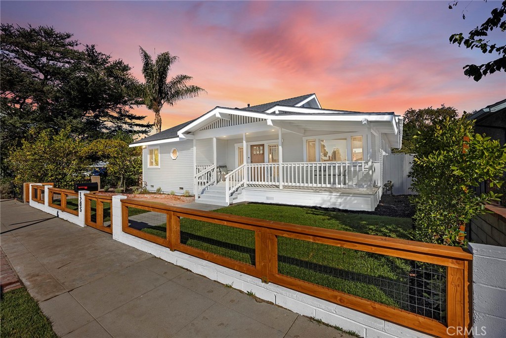 Welcome to 1205 Central Ave a beautifully updated and remodeled Craftsman gem in the desirable lower Raymond Hills neighborhood of Fullerton! This charming home welcomes you with a spacious front porch, perfect for relaxing on warm summer evenings, and is ideally located close to Raymond Elementary School. The main house offers approximately 1,767 sq. ft. of comfortable living space featuring 3 bedrooms and 2 bathrooms, an open and spacious inviting living room, a family room with vaulted ceiling and a cozy fireplace, and a convenient inside laundry room. Natural light fills the home through abundant windows, highlighting the open floor plan, remodeled kitchen and bathrooms, and beautiful wood and tile flooring throughout. Adding to its versatility, the property includes a detached casita/recreation room (approximately 468 sq. ft.) complete with 1 room and 1 bathroom. With alley access and a two-car garage, this home offers both convenience and flexibility. Highlighted features are new windows, sliding doors, A/C Units, Furnace and Roof. The expansive backyard is an entertainer’s delight, featuring a built-in firepit and ample space for gatherings with family and friends. Situated in a prime Fullerton location, this home is within walking distance to award-winning schools, Downtown Fullerton, Fullerton College, Cal State Fullerton, and lots of restaurants, shops, and offers easy access to the 91 and 57 freeways. 1205 Central Ave perfectly blends timeless Craftsman charm with modern updates and unbeatable convenience with a total 2235 sqft of living space— truly a home you’ll be proud to call your own!