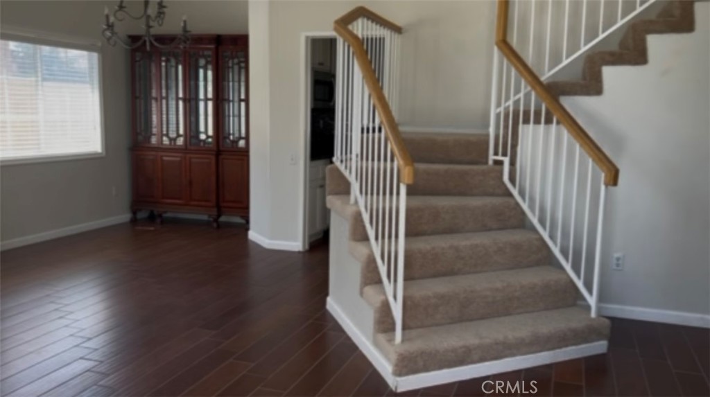Lovely home in the desirable Loring Ranch community! This spacious 4-bedroom, 2.75-bathroom home have 1,931 square feet designed living space, with stunning mountain views and an attached 2-car garage. Inside with neutral tones and wood flooring throughout, adds warmth, elegance, and character to the home. The layout includes a convenient main-floor bedroom and bath, perfect for guests or a home office. The cozy family room or optional dining room with a fireplace—ideal for relaxing on chilly Southern California evenings. The heart of the home is the kitchen, complete with a sink, recessed lighting, range, dishwasher, microwave, refrigerator. and plenty of cabinet space perfect for home chefs and everyday living. Upstairs, the master bedroom features a marvelous bathroom. With central heat and air, flexible layout, and great proximity to local parks, dining, and shopping, this home checks all the boxes for comfort. Don’t miss your chance to make it yours!