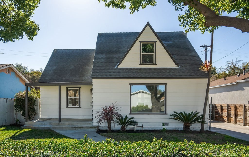 Beautifully and thoughfully updated, this rare Long Beach property with a permitted ADU offers exceptional flexibility, income potential, and modern comfort! The front house features 2 spacious bedrooms, an additional flex space great for an office or nursery, and 2 bathrooms across two levels, while the detached rear unit is a 1-bedroom, 1-bath single-story studio—perfect for rental income, multi-generational living, or a private guest space. Both units have been thoughtfully renovated with luxury vinyl flooring, fresh paint inside and out, designer lighting, new ductless heating and cooling systems, and upgraded kitchens and bathrooms. The kitchens boast quartz countertops, shaker-style cabinets, and updated fixtures, while the bathrooms showcase stylish new tile showers and vanities. Additional details include a custom stair railing in the front unit and a private fenced yard between the homes. A long driveway provides ample off-street parking, leading to a detached 2-car garage. Each unit has its own entrance for added convenience. This turnkey property is close to local parks, shops, dining, major freeways, and just a short drive from the beach and walking distance to Bixby Knolls. Whether you’re an investor, owner-occupier, or multi-generational household, this fully permitted property is a rare find with strong rental potential and lasting value. Don’t miss your chance to own this versatile gem in the heart of Long Beach!!
