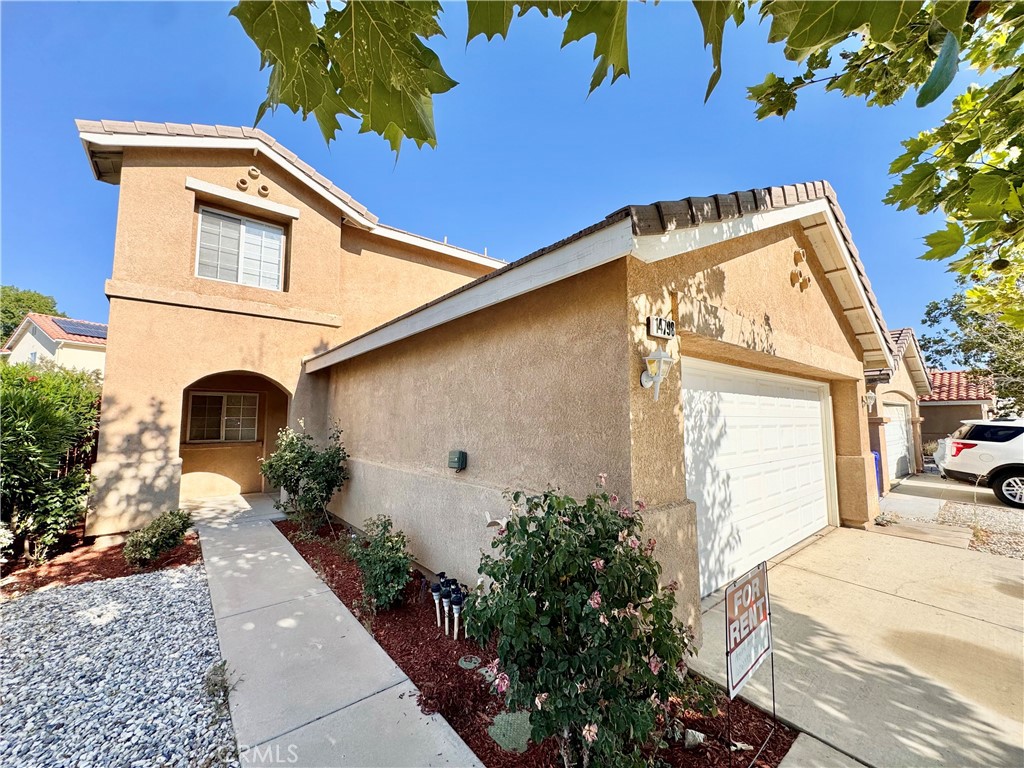 Welcome to this spacious and beautifully maintained 3-bedroom, 2.5-bathroom home located in a quiet and desirable Victorville neighborhood. This two-story residence offers over 1,600 square feet of comfortable living space, featuring an open floor plan with fresh interior paint, a bright living room, a dining area, and a well-equipped kitchen. Upstairs, you'll find a generous primary suite with a walk-in closet and en-suite bathroom, along with two additional bedrooms and a full bath. The home also includes a downstairs guest bathroom, central heating and air conditioning, ceiling fans, dual-pane windows, and a convenient indoor laundry area. The private backyard is perfect for relaxing or entertaining with a covered patio and low-maintenance landscaping. An attached two-car garage provides direct access and additional storage. Located just minutes from shopping, schools, parks, and freeway access, this home is available now for $2,700 per month. Pets may be considered with an additional deposit. Don’t miss the chance to make this move-in ready home yours.