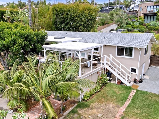 Welcome to this beautifully upgraded coastal cottage offering stunning ocean views and a serene tropical ambiance. Light and bright interiors feature warm wood flooring and an open layout. The main home includes one spacious bedroom and two updated bathrooms, blending comfort and style effortlessly. Fantastic kitchen with granite counters, farm house sink and stainless steel appliances. Kitchen is open to the cozy family room. Primary suite is spacious with spa bath and walk in closet.
Step outside to a private patio perfect for relaxing or entertaining while soaking in the sweeping ocean vistas. Surrounded by lush, beautifully landscaped grounds on an impressive 23,000 sq. ft. lot, this property offers a true sense of paradise.
An added bonus is the detached guest house, complete with one bedroom, a full kitchen, and a bathroom—ideal for guests, extended family, or potential rental income.
Located in a fantastic location just minutes from the beach, shopping, and freeways, this is an exceptional opportunity to own a slice of coastal heaven. Don’t miss this unique gem!
