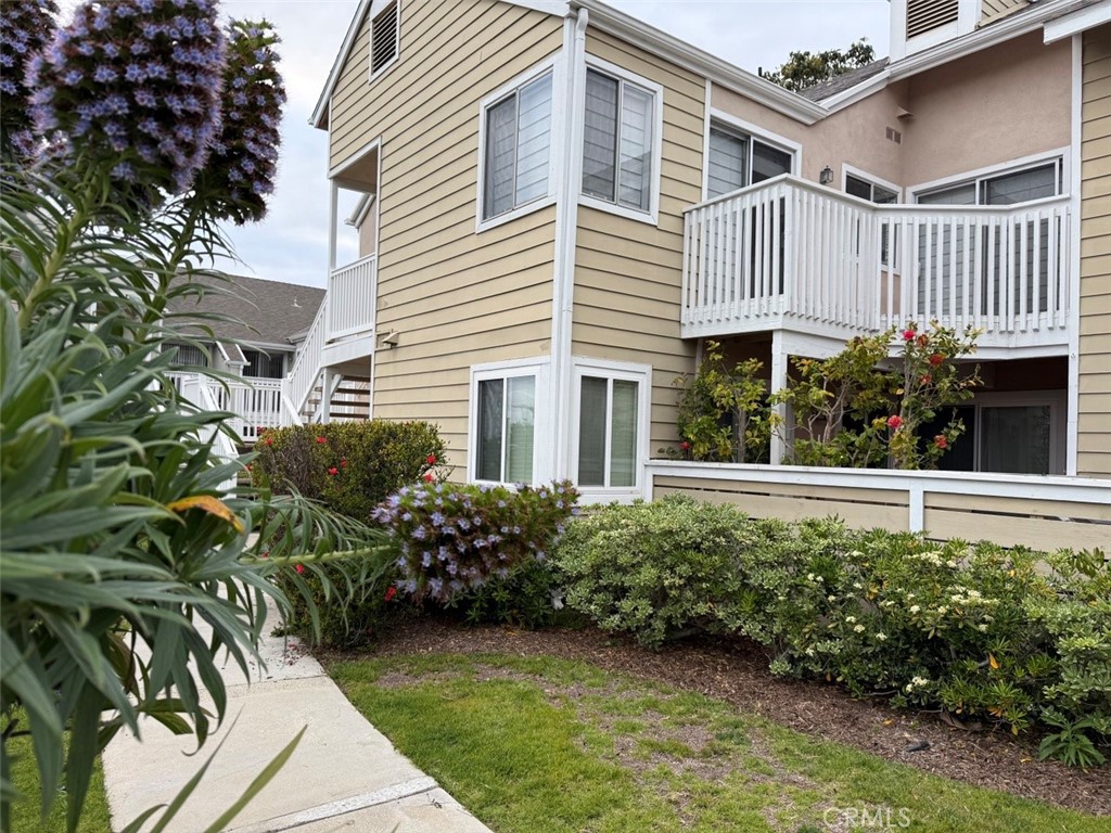 BEACH LIVING AT IT'S FINEST! Experience the allure of coastal living in this stunning and thoughtfully remodeled two-bedroom, two-bathroom end unit home. A true gem in the charming city of Dana Point. This attentively designed unit blends timeless style with up-to-date conveniences in the most desirable location on the ocean side of Pacific Coast Highway in the Charming community of Niguel Beach Terrace only steps to the breathtaking Strands Beach. Enjoy Stunning Brazilian tiger-wood hardwood floors in the living, dining, kitchen, bedrooms and hallways. Generously equipped kitchen with custom cabinetry, newer appliances (new top of the line LG four door refrigerator, Bosh dishwasher, Maytag range, washer, dryer), custom countertops and backsplash. Enjoy the morning and afternoon sun filled and airy interior with custom designed bathrooms. New windows and sliding doors throughout. Two sizable patios with a large storage closet and enclosed laundry area, as well as ocean view from the entry patio! Assigned covered carport and ample guest parking. The community amenities include a pool, spa, nearby Dana Point Preserve, Hilltop Conservation park and Dana Point Bluff Trails only a few steps away just out the front door! Experience the enchanting Lantern district with several renowned restaurants and cafes, shopping, galleries, gym, picturesque Dana Point Harbor, Salt Creek Beach, the Ritz Carlton and so much more! ***Owner pays for water, trash *Tenant pays for electricity, wifi connectivity *Will consider longer Lease terms *Assigned covered parking + guest parking *Strictly No smoking *Pets allowed subject to mutual agreement *Maintaining the current pristine condition. Schedule a showing today!