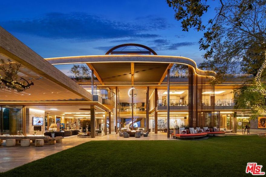 Introducing Villa Siena the latest masterpiece by visionary, Ardie Tavangarian of Arya Group. This approx. 35,000 SF (and extraordinary 12,000 SF rooftop with endless amenities) estate truly has it all including a primary suite with a retractable roof that opens for stargazing. An outdoor sauna pod has a glass wall for admiring views of a nearby golf course. Other amenities include a spa, a screening room, a bar, and an "auto gallery"/Jazz Club with space for six cars. The home's design was inspired by nature and incorporates elements of fire and water, Tavangarian said. The exterior is clad entirely in natural materials like teak and stone. Inside, a four-story, bronze-finished staircase is suspended from the ceiling to give it the appearance of floating. There is a reflecting pool at the base of the staircase, and 30-foot pivot doors lead to the outside. A wine room is accessed through 200-year-old antique doors. The spa has amazing water journey, hot and cold plunge pools and a hydrotherapy chamber (red light therapy). Designed to feel like it's in the forest, the spa has lush plantings on the ceiling and LED screens playing videos of tropical​​‌​​​​‌​​‌‌​​‌​​​‌‌​​​‌​​‌‌​​​‌​‌​​​‌‌​ scenes.