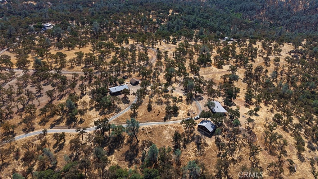 Escape to privacy and potential on this expansive 20-acre property, offering the perfect blend of seclusion and convenience—just 20 minutes from town. With two separate homes, this versatile estate is ideal for multi-generational living, rental income, or creating your own homestead sanctuary. The land features three wells and ground mount solar power, giving you self-sufficiency and sustainability. Rolling acreage and open space offer endless opportunities for farming, gardening, livestock, or simply enjoying the wide-open views and quiet setting. Whether you’re seeking a private retreat, a family homestead, or an investment opportunity, this property checks every box!