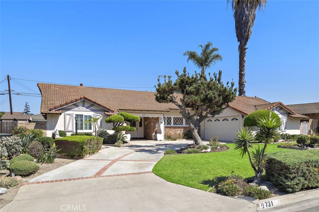 What a rare opportunity! This charming single-level residence sits on an impressive 8,625 sq ft interior lot in one of Garden Grove’s most desirable neighborhoods. Lovingly maintained by the same family for over 50 years, this home offers timeless character, incredible potential, and room to make it your own. Featuring 1,943 sq ft of living space, the floor plan includes 4 spacious bedrooms and 2.5 baths. The serene primary suite offers a walk-in shower with glass door and tiled counters, while three additional guest bedrooms share a hall bath with tub/shower combo. The large fourth bedroom with a private entrance is tucked away at the end of the hall, perfect for guests, extended family, or a home office. Inside, you’ll find a bright and inviting kitchen with tile countertops, an oversized eat-in kitchen is perfect for everyday use, and a separate laundry room for convenience. The expansive living room features sliding doors that lead to your backyard oasis, while the banquet-size formal dining room has rich beamed ceiling, real hardwood floors and is centered around a cozy brick fireplace —perfect for entertaining and holidays. Step outside to a large, covered patio, perfect for family gatherings, barbecues, or relaxing evenings outdoors. The spacious backyard features mature landscaping, a lush lawn, and multiple fruit trees—including fig, persimmon, tangerine, orange, and lemon—creating a private retreat for everyday living. Additional highlights include picture-perfect curb appeal, scraped ceilings, A/C and real hardwood flooring. The location is unbeatable—close to shopping, restaurants, schools, community college, freeways, Disneyland, Anaheim Stadium, and all that vibrant Garden Grove has to offer. Don’t miss this rare chance to own a true Garden Grove classic with endless possibilities!