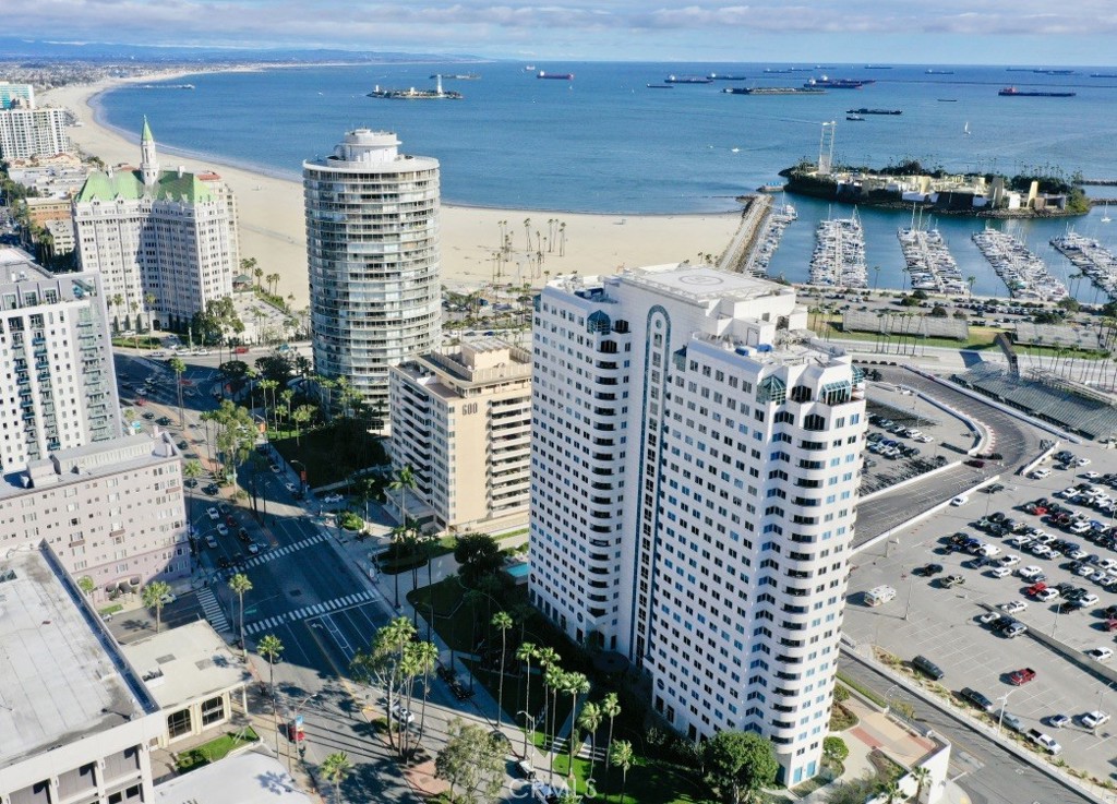 Wake up to panoramic vistas of the Pacific Ocean and the iconic Queen Mary! Unit 305 boasts unobstructed ocean views, offering a front-row seat to the iconic Long Beach landmarks and its most popular events. Central air and heat ensure year-round comfort in the unit and the private balcony is perfect for unwinding in the evenings. The building, Harbor Place Tower, offers resort-style amenities that include a modern lobby, sparkling pool with sun deck, spa, gym, sauna, fire pit, ping pong table, meeting room, viewing deck and 80 guest parking spaces. The 24/7 security guard on duty at the building adds peace of mind and a package concierge is available for residents convenience. Location is highly walkable. The beach and its walk/bike path is a short walk away as well as a variety of restaurants, bars, coffee shops, the famous Pine Ave, the Shoreline Village and The Performing Arts Center. The building is in the center of the new growth of the vibrant downtown Long Beach and across the street from the planned 2028 summer Olympics site.