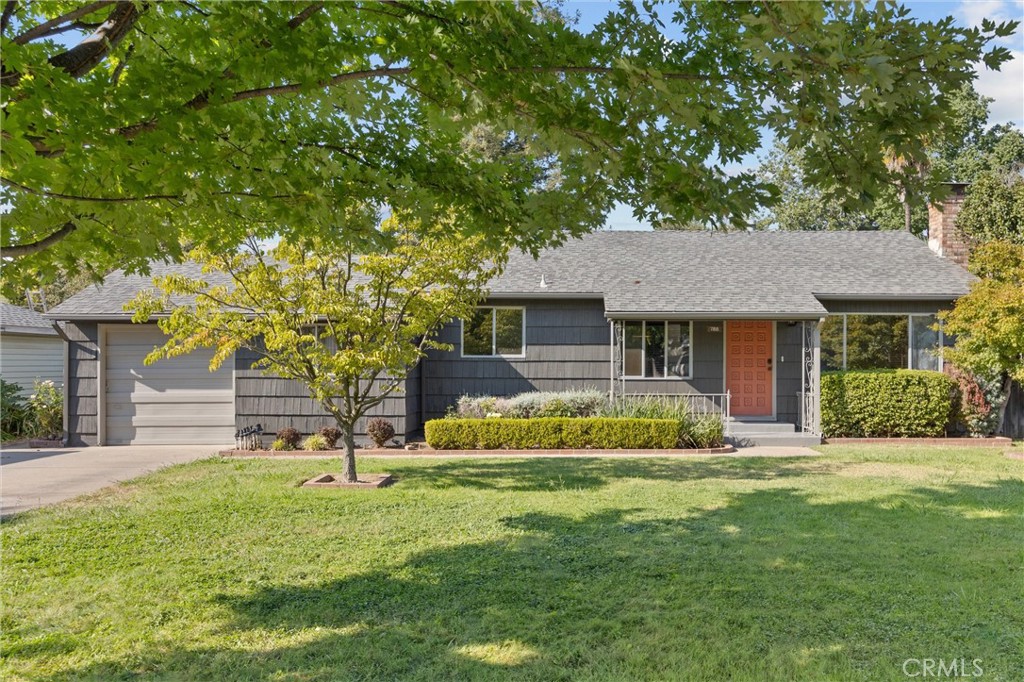 Charming 1950s Bungalow on a Large Lot! This beautiful 2 bedroom 1 bath home has tons of character with custom details, a unique extra large bonus room, and great natural light! With fresh exterior paint, hardwood floors, a wood stove insert with stone surround, built in features, and more - this home won’t last long! The bonus room is perfect for entertaining - with a built-in BBQ area, sink, lots of counter and storage space, brick features, wood paneling, and tons of windows looking out to the spacious backyard. Outside you will find a concrete patio, lawn area, and additional space to plant the garden of your dreams, this backyard truly has so many possibilities. There is also an attached extra large 1 car garage with a workshop area as well as storage, RV parking, 2 driveways, and so much more! Don’t miss the opportunity to own this charming home priced at $349,000!