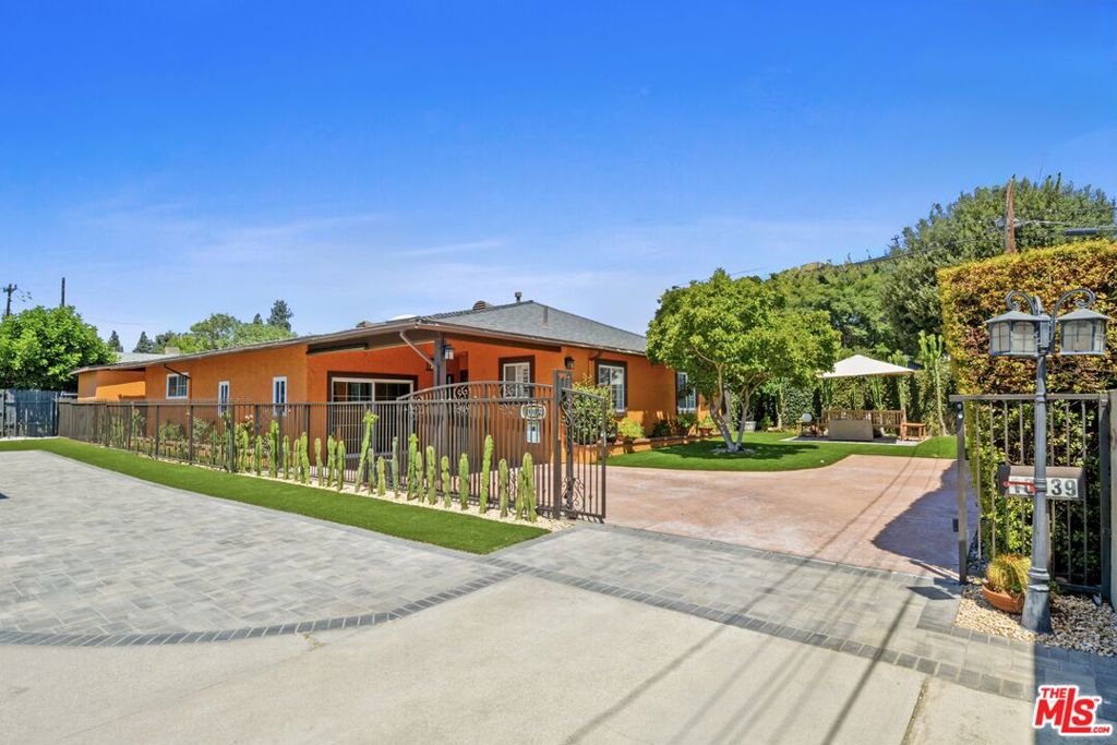 This beautifully remodeled and well-maintained home in Temple City is perfect for those seeking both space and privacy. Nestled on a private driveway away from the main road, the property is gated for added privacy. Inside, you'll find a spacious open floor plan accentuated by stunning Spanish-style arch detailing. The large living room flows effortlessly into the dining area, which leads into a modern, remodeled kitchen. The home features four generous bedrooms and two fully renovated bathrooms, plus a bonus room that can serve as a game room, office, or even a fifth bedroom.