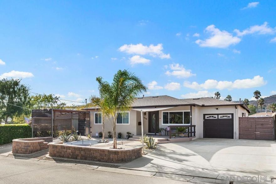 Welcome to this beautifully updated 3 bedroom, 2 bath home with an attached 1-car garage, thoughtfully upgraded inside and out for modern comfort and efficiency. Major improvements at a cost of over $175,000 include owned solar with Enphase battery system (2023), a new roof with low-profile vents (2023), new 200-amp electrical panel, and an EV charging outlet—making this home energy-smart and future-ready. Enjoy year-round comfort with newer dual-pane windows, central HVAC, plus mini-split system in family room, new A/C condenser (2023), and a replaced water heater. Additional enhancements include a fiberglass front door with glass insert, updated flooring, low-flow toilets, and modern LED lighting throughout. The exterior is equally impressive with a freshly painted façade, rain gutters and drainage, retractable awnings, and an air curtain system at entry points for added efficiency and fly prevention. The professionally designed landscaping showcases drought-tolerant features, turf backyard with drainage, and a striking front yard with decorative country manor wall, pathways, palm & agave trees, curved patio with shade sail, and decomposed granite accents—perfect for low-maintenance outdoor living. This remarkable and highly updated home combines style, energy efficiency, and modern convenience in one incredible package. Centrally located in the coveted Brookside Neighborhood in La Mesa for easy commute and everyday conveniences.