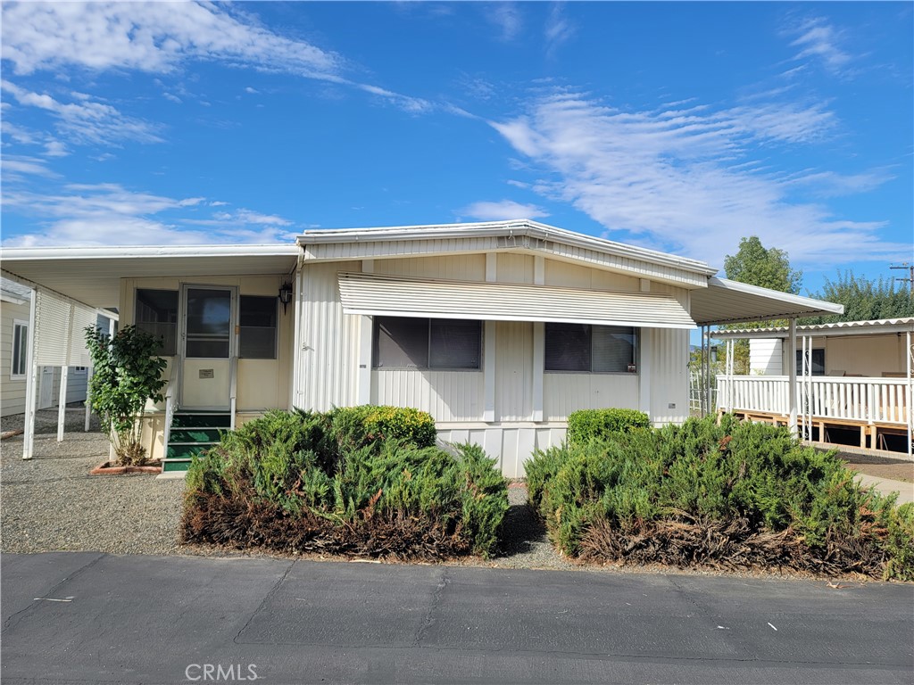 Age restricted community.  Primary resident must be 55 or older.  Secondary 45 or older.  Wells maintained Manufactured home in the Lovely sought after community of Canyon Homes.  Recessed lighting in living room and dining area.  Approximated 10'x17' permitted area off the primary bedroom.  Can be used as work out room, office or a hide out.  There is a door that goes out to a 9x9ish' deck.  There is also an approximate 10'x17' enclosed sun room.  Storage shed has a window air conditioner and was used as a workshop.  Kitchen has newer counter tops and a breakfast bar.