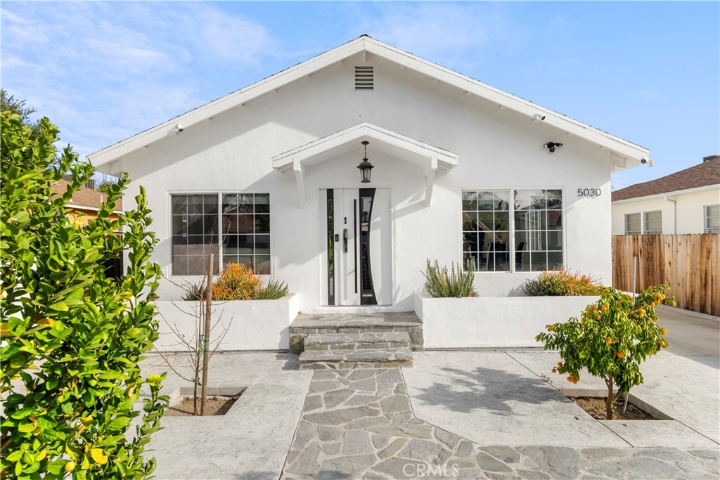 Prime Encino neighborhood south of Ventura Boulevard, this beautifully remodeled single-story home offers 5 bedrooms and 3 bathrooms, including two primary suites designed for ultimate comfort and privacy. A secure gated entrance leads to a private front yard adorned with stylish hardscaping, flourishing fruit trees, and ample parking for multiple vehicles. The open concept living area showcases new tile flooring that extends throughout the home, creating a seamless flow between spaces. Chef's kitchen featuring quartz countertops, custom soft-close cabinets, stainless steel appliances, and a built-in pantry. Step outside to your private oasis, complete with a heated pebble finished pool and spa perfect for relaxation and entertaining. The property is equipped with modern eco-friendly amenities, including solar panels, a Tesla charger, and a tankless water heater, ensuring energy efficiency and sustainability. Enjoy peace of mind with integrated security cameras, a Nest thermostat, and smart locks featuring facial recognition for enhanced security. This home offers unparalleled access to Encino's finest dining, shopping, and entertainment options, offering a lifestyle of comfort and convenience