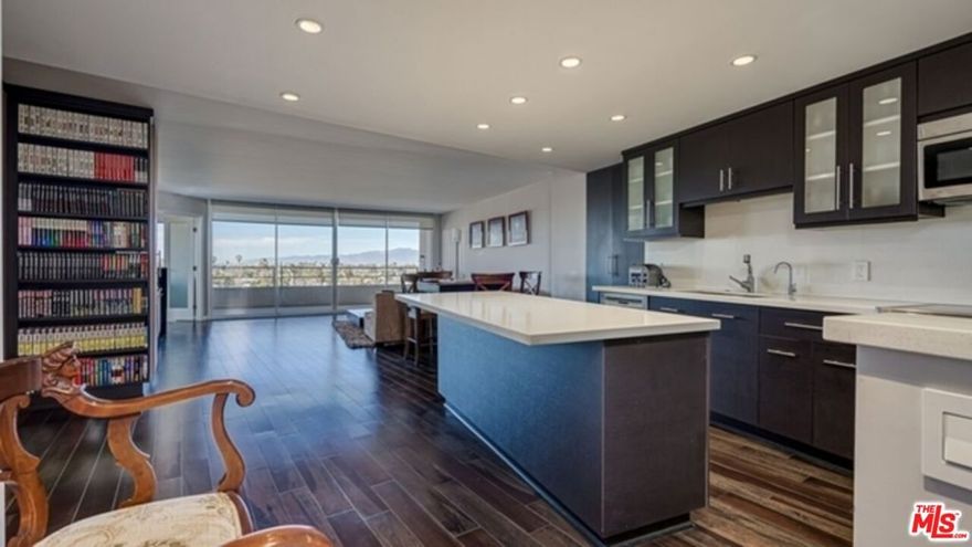 Incredible location ! Nestled in Private Marina City Club , this gorgeous end-unit condo offers luxe living in peaceful Marina Del Rey . Stunning city and mountain views from floor to ceiling windows in the master bedroom and living room . Minutes from high end shopping , airports , and ocean-front bike and walking path's .Stroll to Venice boardwalk or savor bountiful local beaches, state parks and farmers markets . Chef's kitchen with new high-end appliances , hardwood floors , custom bathroom's and modern designer finishes throughout . Enjoy the ultimate Marina City Club lifestyle featuring : 16,000 s.f. executive gym with free yoga , spinning , pilates , cleaning service , car wash , salon and 24 hr gated and guarded security .
