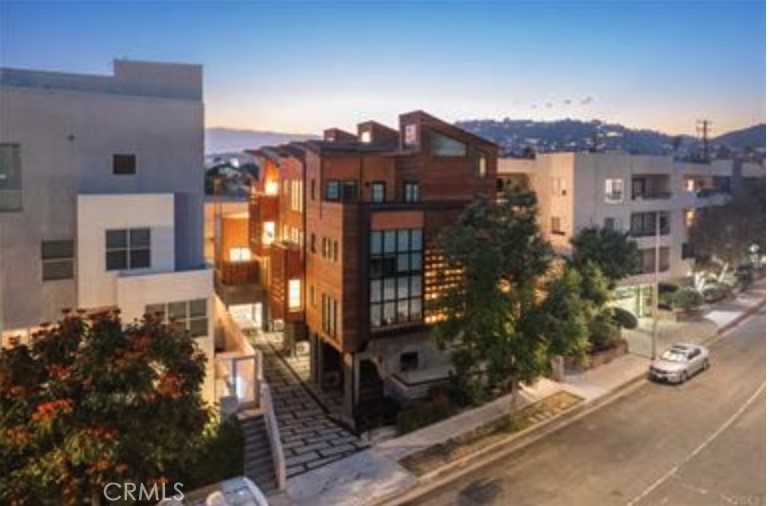 Modern Elegance Meets Urban Convenience: Welcome to this stunning fully detached multi-level 2 bed, 2.5 bath residence built in 2021, blending contemporary design with everyday comfort. Dramatic ceilings and an open-concept floor plan create an airy, expansive feel, while premium appliances and designer finishes bring luxury throughout.
Perfect for entertaining or working from home, this property offers multiple outdoor spaces, including a private backyard, a built-in BBQ with refrigerator, and a large balcony off the master bedroom. The master suite also features vaulted ceilings and a spacious walk-in closet, adding both comfort and convenience.
Additional highlights include a private gated entry, a two-car garage, abundant natural light, and the flexibility to be used as a live/work residence. Located in the heart of West Hollywood, you’re just moments from the city’s best dining, shopping, and nightlife. Whether preparing meals in the chef-inspired kitchen, or setting up your workspace, this home is designed to elevate your lifestyle in every way.