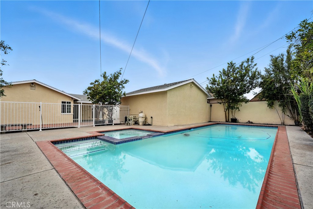 Welcome Home to the highly desired San Tract of Buena Park! This single-story 4 bed, 2 bath home shines with fresh paint inside & out, new flooring, a cozy fireplace, and a spacious galley kitchen. Stay cool year-round with a whole house fan.
The backyard is a private retreat with a sparkling pool & spa, covered patio, and fruit trees throughout—with plenty of room to expand and be creative. The huge driveway fits multiple cars, RV, or boat, and the detached garage is ADU-ready—perfect for extended family or extra income
Schools: Zoned to the highly rated Buena Terra Elementary (Niche “A” rating, California Distinguished School, 77%+ proficiency in math & reading), plus Walker Junior High and Kennedy High. Families may also apply to the award-winning Oxford Academy.
Close to Knott’s Berry Farm, The Source OC, Ralph B. Clark Park, and Los Coyotes Country Club, with quick access to the 91 & 5 freeways and Metrolink.
This home has it all—fresh updates, poolside living, fruit trees, ADU potential, and one of the area’s best elementary schools—all in one perfect Buena Park location!