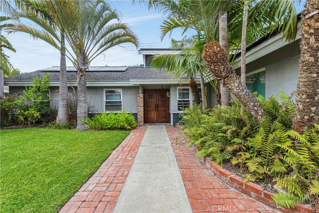 Welcome to 1956 Flamingo!! This property is perfectly situated in the highly sought-after LOWER BIRDS neighborhood of Mesa Verde. The front of the home is beautifully landscaped and lined with swaying tropical palm trees, this home feels like your own slice of paradise. As you enter, you're welcomed into the spacious kitchen and dining area, the heart of the home, offering plenty of room to cook, gather, and entertain. Step into the inviting living room, where a cozy fireplace and gorgeous wood-trimmed French doors that open to your TROPICAL BACKYARD RETREAT. Designed for relaxation and entertaining, the outdoor space features a sparkling salt water pool, above-ground spa, multiple seating areas, and lush landscaping with soaring bamboo and mature palm trees creating the ultimate private escape. Upstairs, the expansive primary retreat spans the entire second floor, boasting soaring wood ceilings with stunning exposed beams, generous closet spaces, and room for a sitting area where you can unwind to the soothing sound of backyard fountains. The home also includes a secondary primary suite on the main level with a beautifully remodeled ensuite bathroom, plus two additional bedrooms and a guest bath—perfect for family and friends. This is more than a home—it is a true slice of paradise in one of Costa Mesa’s most desirable neighborhoods. ***PROFESSIONAL PHOTOS COMING SOON***
