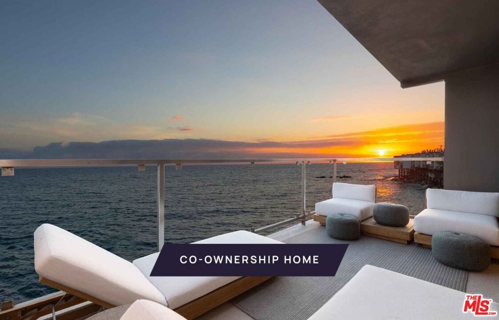 New co-ownership opportunity: Own one-eighth of this turnkey home, professionally managed by Pacaso. Named for the beach just steps away, Las Flores is a perfect oceanfront hideaway, with stunning views of the sparkling Pacific, islands and Queen's Necklace. This two-story contemporary has decks on both levels and private steps leading to the shore. Inside, the open concept layout is all about endless vistas, relaxation and entertaining. The first floor has floor-to-ceiling, wall-to-wall glass sliders plus a picture window, framing views to enjoy the living and dining area as well as the gourmet kitchen. The doors open to a covered balcony perfect for al fresco dining. The kitchen features Caesarstone countertops, high-end stainless steel appliances, a beverage fridge and bar seating. Behind the kitchen is a handy laundry area and a full bathroom is nearby. One of two staircases leads directly to the primary suite, which features a fireplace, a beachfront balcony and a spa-style en suite bathroom with a soaking tub, tiled shower and dual-sink vanity. The other stairway goes to a landing with doors to a private patio. Also on this level are a guest bedroom and bathroom, and a family room/office which is also accessible from the primary suite. This getaway is midway between Malibu and Santa Monica, and close to Duke's Malibu, Nobu and shopping. The home, which has a two-car garage with a second refrigerator, comes fully furnished and professionally decorate