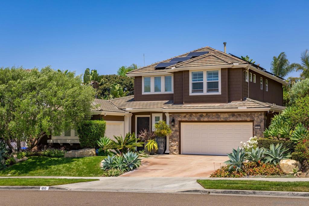Located in one of Carlsbad's most desirable coastal neighborhoods, Bay Collection, this beautiful home offers style on the outside and pure luxury on the inside. * * Through the front door you're greeted with soaring ceilings, grand staircase, elegant living room with built-ins and formal dining room, while the back of the home will draw you in with its newly remodeled eat-in kitchen offering a large island, stunning porcelain counters, marble tiled backsplash, custom white cabinetry presenting ample storage, coffee or wine bar walk-through station, and top of the line appliances that include a Wolf range/oven that acts as the centerpiece of the kitchen. The primary bedroom is conveniently located on the first level, with French doors leading to the peaceful backyard with lush landscaping and fire pit. The 3 additional spacious bedrooms are upstairs, with one offering OCEAN VIEWS and one offering an en-suite! This location lends for easy living as you're surrounded by world-class beaches, restaurants, shopping and golf courses. The home has been lovingly maintained with updated plumbing fixtures, newer tankless water heater, newer AC and upgraded appliances. OWNED solar, lifetime warranty on new exterior paint, new side gates, and many warranties still in place from remodel that will be transferred to new owners. Don't miss out on this turn-key home!