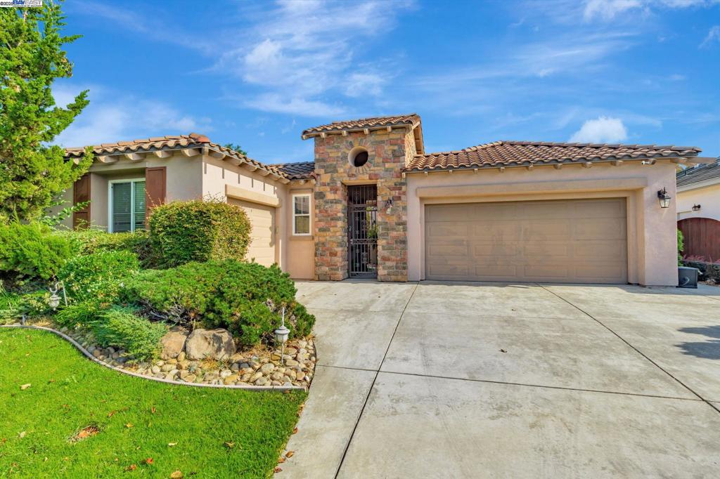 Welcome to 1145 Hartwell Ave, a Beautiful ONE story 4 bedroom, 3 bath home in the gated community. Courtyard in entry for privacy. Master suite separate from other bedrooms, large jetted tub, shower stall, large walk-in closets; bonus room with custom built in cabinet. Living room with tall ceilings, space for formal dining area in front room. Kitchen has large dining bar with Large family room with fireplace. Gorgeous professionally landscaping front and backyard with beautiful stamp concrete. Come and See it!