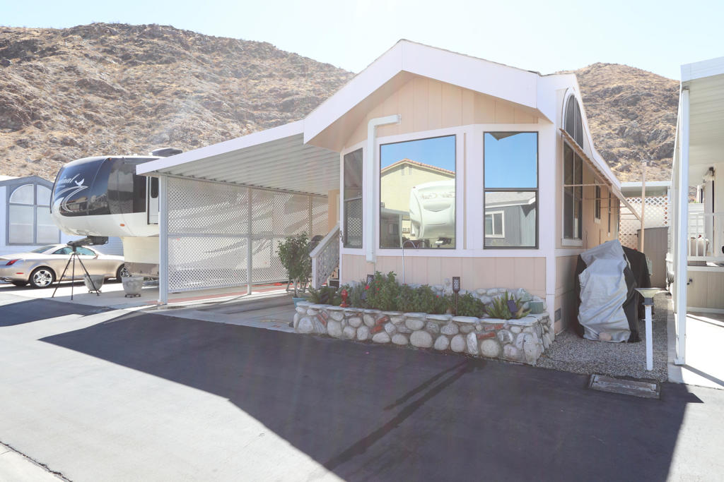 Discover this rare gem: a spacious 2-bedroom residence featuring a private all-weather shaded deck, perfect for outdoor relaxation. Equipped with a convenient washer and dryer, this home offers both comfort and practicality.Located in a prime area bordering Rancho Mirage and Cathedral City, you'll find yourself close to all the amenities you could desire. With low monthly dues of just $342, which covers both the HOA and land lease, this is an incredible opportunity in a senior community for those aged 55 and better.The furniture is negotiable, making it easy to personalize your new space. Enjoy the security of a gated community, just minutes away from Palm Springs, Mary Pickford Cinemas, dining, casinos, and more.Whether you're seeking an investment property, a second home, or a primary residence, this home is perfect for year-round living. Take advantage of community amenities, including pools, spas, a clubhouse, and so much more. Don't miss out on this exceptional opportunity!