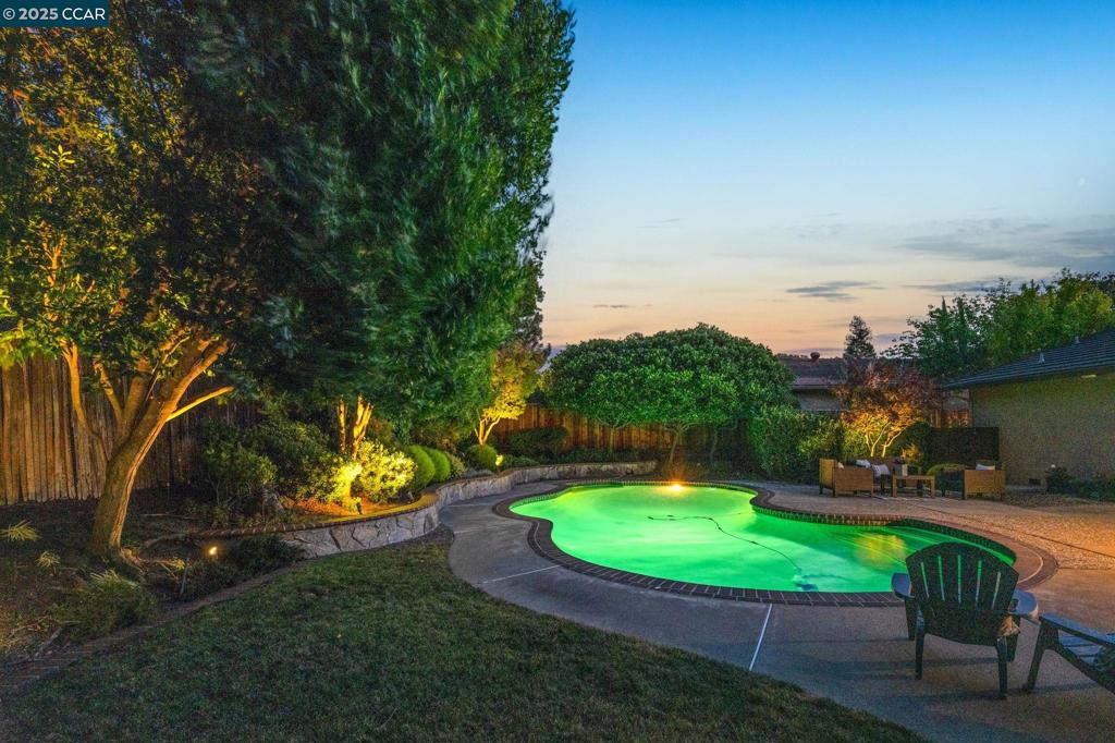 **Open SAT 11:00 - 1:00** Northgate gardener’s delight on a lush quarter-acre with a resort-style pool. Offered at $1,700,000, this immaculate single-story 4BD/2BA (~2,052 SF) delivers seamless indoor–outdoor living on a beautifully landscaped 0.27-acre lot with multiple zones for dining, relaxing, and swimming. Tucked in a charming, tree-lined pocket, it blends everyday ease with peaceful backyard living. Inside: freshly painted interior, vaulted ceilings with wood beams, recessed lighting, plantation shutters, and an updated kitchen with white cabinetry & stainless appliances. French doors open to a side-yard patio with a fountain—perfect for morning coffee. The oversized primary suite offers several closets and French doors to the lush yard and sparkling pool. Northgate perks: highly rated schools, nearby parks, trail access, and the neighborhood’s swim/tennis culture—while just minutes to downtown Walnut Creek, BART, and Hwys 680/24 for effortless commuting, dining, and shopping. Cherished by the original owners—this beauty is now ready for its next owner!