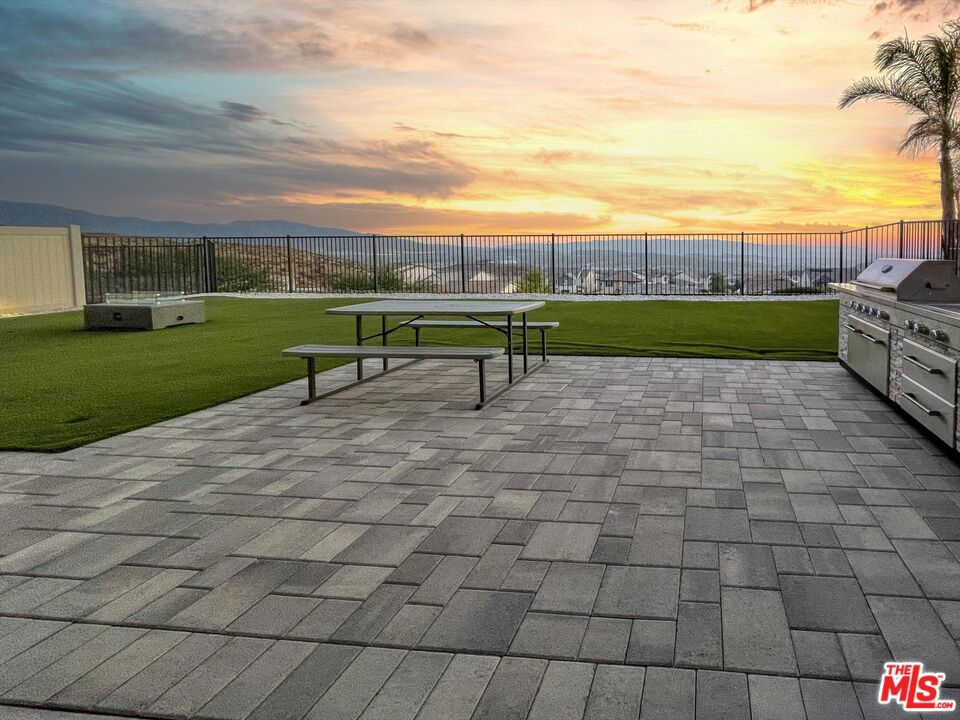 Enjoy lower monthly payments for the first two years! Seller is offering a 2-1 interest rate buydown to make your purchase more affordable!! Welcome Home to 28521 Sparrow Way, a beautifully upgraded home newly built in 2020 with VIEWS located in the popular and sought after community of Skyline in the heart of Santa Clarita. This thoughtfully designed SMART home features an open-concept layout with a spacious living area, modern finishes, and an abundance of natural light. The Skyline Community is a picturesque master-planned community that is so thoughtfully designed. The neighborhood offers residents a perfect blend of natural beauty and modern convenience, with easy access to parks, trails, schools, and shopping. At the heart of Skyline are two beautiful community centers that feature resort-style amenities designed for comfort, wellness, and connection. Residents enjoy access to sparkling pools and soothing spas, state-of-the-art fitness centers, and cozy outdoor lounge areas complete with fire pits and fireplaces. ideal for evening gatherings. The clubhouses also include barbecue areas, play zones, and scenic spots to relax or entertain. Whether you're taking a morning jog along the winding paseos, spending the afternoon at the private park, or enjoying the breathtaking mountain views, Skyline offers a lifestyle that feels like a daily retreat and resort all located minutes from your new home. The kitchen is a chef's dream, complete with granite countertops, stainless steel appliances, a large island, and an oversized pantry. Throughout the home, you'll find recessed lighting, smart thermostats, and app-controlled dimmable lighting that enhance both style and functionality. Upstairs, the generous loft provides flexible space for work or play, while the primary suite offers a serene retreat with a spacious walk-in closet and en-suite bath featuring a walk-in shower, soaking tub, and quartz countertops. Secondary bedrooms include pre-wired fan/light switches and dimmable lighting for comfort and convenience. Take advantage of two solar systems designed to keep your power bills close to zero! An entertainer's backyard with a covered patio, firepit, BBQ, turf, pavers, and a storage shed with VIEWS! The three-car garage is EV-ready and includes a smart opener and water softener loop. Additional features include a tiled entryway, modern vinyl flooring in wet areas, programmable outdoor lighting, and a well-appointed laundry room with quartz counters and overhead drying rack. This move-in ready home blends comfort, energy efficiency, and indoor-outdoor living perfect for enjoying all that Santa Clarita has to offer. Close Proximity to 14 Freeway to I-5. This home offers not just a beautiful home, residents enjoy easy access to a variety of local amenities, including nearby parks like Central Park featuring sports courts, playgrounds, and scenic trails and the Santa Clara River Trail, perfect for biking or leisurely strolls. Outdoor enthusiasts will also appreciate the proximity to the Santa Clarita Woodlands Park for weekend hikes and nature outings. Convenient shopping and dining options are just minutes away at Westfield Valencia Town Center and Old Town Newhall, where you'll find everything from popular retail stores to charming boutiques, trendy eateries, and entertainment venues. Whether you're grabbing coffee, dining out, or exploring local shops, you'll love the balance of suburban tranquility and modern convenience this location provides.