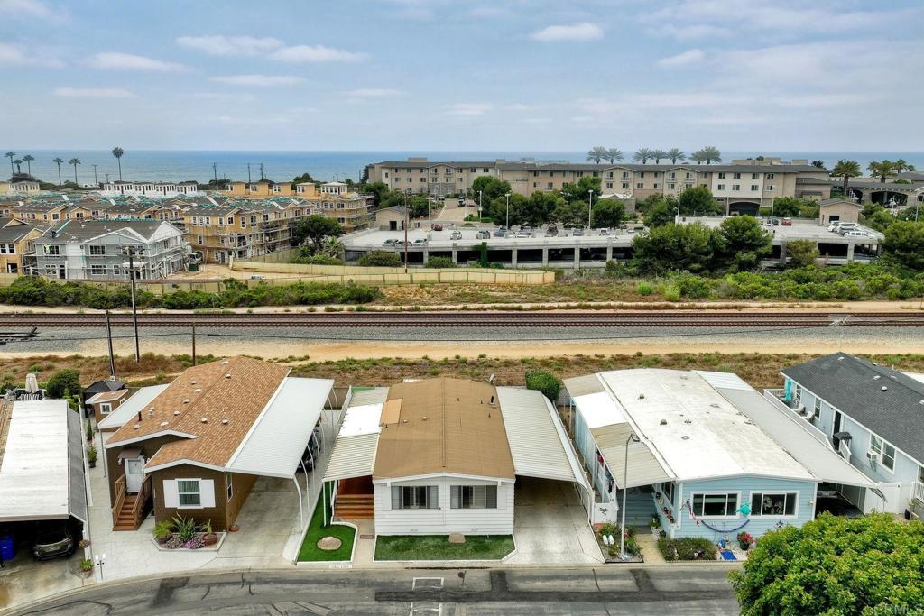 A rare opportunity in the highly sought-after gated community of Lakeshore Gardens. This 2/2 manufactured home is ideally situated, backing onto expansive open space with access to walking trails and just moments from the beach and shopping. Enjoy ocean breezes and the vibrant coastal lifestyle. Community provides an array of amenities, including a state-of-the-art gym, sparkling pool, billiards room, and welcoming clubhouse, all set amidst picturesque man-made lakes. Unwind on your private back deck, under a retractable awning – the perfect sanctuary for relaxation. Inside, an open floor plan and plantation shutters throughout. This is more than a home; it's a lifestyle. Priced to sell. Don't miss out on this one! Some furniture also for sale.