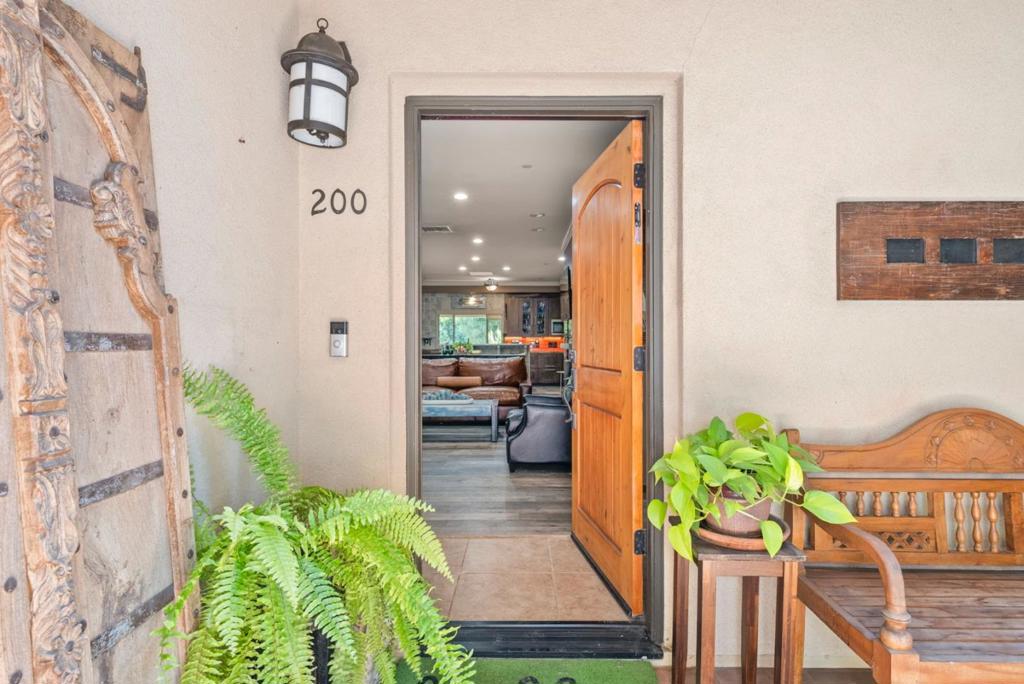This luxury and spacious townhouse offers a layout that feels like a custom Tuscany-style single-family home, featuring a clean, modern living design throughout. Extensively renovated within the last five years, these changes will last for many more years. With 3 private entrances and 2 exterior decks, the top floor is dedicated to a luxurious master suite, complete with a private entrance that can serve as separate living quarters, as well as a balcony offering stunning 180-degree mountain views, a skylight, a gas fireplace, a wet bar or kitchenette, and a master bath. With new flooring, fresh paint, updated tile work, and new windows, this home is truly move-in ready. With a low HOA fee and only four units in the building, the property offers secure, gated parking with an enclosed one-car garage and an additional designated space. Located in the sought-after Olinder neighborhood, near Naglee Park, San Pedro Square, SJSU, the Shark Tank, and with easy access to major highways (101 FWY) and Silicon Valley tech companies, come walk through and see how turnkey this property truly is!