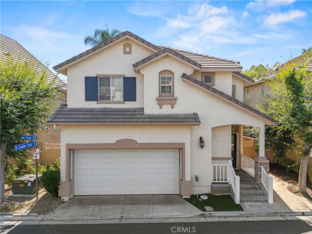 Located in one of the best parts of Valencia close to so much the city offers, this move-in ready Brighton Village home includes a rare BALCONY off the primary suite and is set on a cul-de-sac with a low HOA and NO Mello-Roos! Boasting 3 beds and 2.5 baths and charming curb appeal, you’re welcomed into the light and bright home with a freshly painted interior and rich, dark wood-like flooring. A cozy gas fireplace sets the focal point in the main living area with a ceiling fan and dining area between your living room and open-concept kitchen adorned with granite countertops, a pantry with pullout shelving, plenty of cabinetry, recessed lighting, and a fridge, dishwasher, and built-in microwave included. Past the downstairs powder room/half bath, newer soft carpet takes you upstairs where you have your 3 bedrooms (all with ceiling fans), full size laundry closet (washer and dryer included), a full hallway bath, and a quaint loft perfect for a desk or reading nook. One of your bedrooms features French glass doors and plantation shutters that could be a perfect home office. Your primary suite has been freshly painted and includes a walk-in closet, spacious balcony, and double sink vanity with a drop in bathtub/shower combo. Your backyard features low maintenance turf and is a good size perfect for al-fresco dining in the cool, summer evenings beneath the attached pergola! Newer water heater just installed August 2025. Your HOA amenities include a sparkling pool/spa and BBQ area perfect for entertaining guests! You’re centrally located to Valencia’s plethora of eateries, shopping plazas, strip malls, paseos, parks, award-winning schools, and so much more! Come and make this turn-key gem your own!