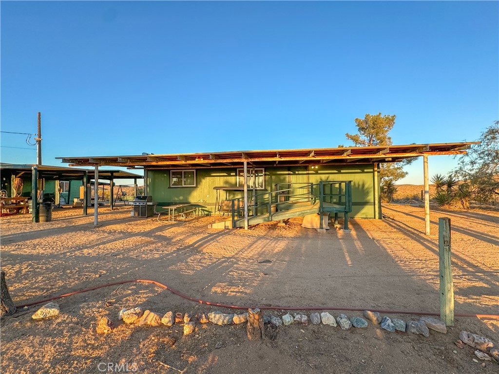 GORGEOUS DESERT GETAWAY DREAM!!! Vacation here or live here full time with all the amenities one could want! This 20 acre property boasts amazing panoramic views! Spacious 3 bedroom 2 bathroom home with newer windows and mini split for heating and cooling. 1000 square foot detached 2 car garage with workshop and bathroom attached complete with concrete pad and 2 post lift. 40 foot storage container for added storage. Property has a private well for all the water you could ever want, septic system and electricity! Enjoy the Mohave Trail, hunting, hiking and all that the Mohave Preserve has to offer. Don't miss out on this amazing opportunity!