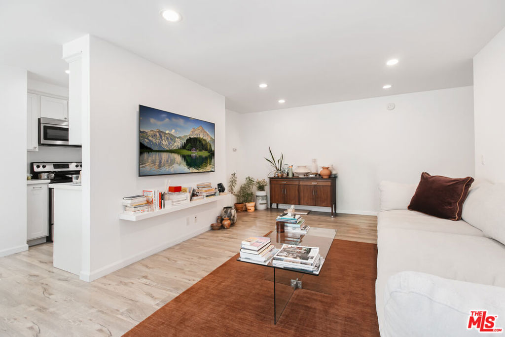 This property is located in a census tract designated as a High Cost Area. For first-time homebuyers with income under $11,350/mo, the High Cost Area Purchase Program offers up to $14,451 in agency credits for an interest rate buydown. Beautiful remodeled 1 bed, 1 bath condo in the highly sought-after Hancock park/Miracle Mile area featuring updated flooring, sleek stainless steel appliances, and a private balcony. Two covered parking spaces add convenience in the heart of the city. Enjoy the peace of mind of a secure gated garage with cameras and key fob entry, plus the amenities of Sycamore Villas: a heated pool, sauna, rec room, and community laundry. Pet-friendly and centrally located just minutes from the vibrant dining and shopping scene on Melrose and La Brea. This condo offers the best of comfort, style, and convenience.