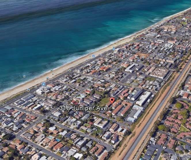 CARLSBAD BEACH CONDO only one & half blocks to the beach! Walk to the boardwalk, Carlsbad Village, beach, restaurants and more. This upstairs unit features 2bd, 1bth, with an enclosed balcony loft, covered carport parking, large ground level private storage area. All this in a private gated community that makes parking a breeze.