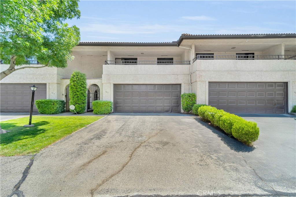Enjoy low-maintenance living in the desirable Antelope Valley Country Club community! This spacious 3-bedroom, 2.5-bath condo offers nearly 2,000 sq. ft. just minutes from the 18-hole golf course, tennis courts, and clubhouse. The well-designed layout features large bedrooms, including a primary suite with a walk-in closet and private balcony—perfect for unwinding. The two additional bedrooms share a second balcony, offering extra storage or a quiet space to relax. A private patio off the downstairs living area adds great outdoor functionality. This community offers well-kept greenbelt areas for added privacy and serene surroundings. Water, exterior and roof maintenance are all included, making this home as practical as it is comfortable. With a newer HVAC system installed in 2021 and priced to sell, this is a must-see opportunity. Call today to schedule your private showing!