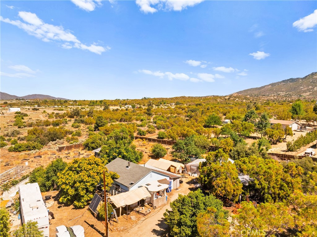 Are you looking for a scenic piece of land with a view? Looking for the Country life but still close to town? We got you! This 2-acre property is located in Anza and features a 1 bedroom, 1 bath, 780-foot square foot home. There are a few outbuildings located on the property near the main house. There are amazing 180-degree views from the property of the local mountains and valley. Property is on septic and well. There is a 3000-gallon water tank and another 2700-gallon extra water tank that seller will leave with the property. There are fruit trees - 2 red apple, 2 green apple, 1 Pomegranate, 1 Pear, 1 Peach, and 1 Lemon. Property is fully fenced- some with wood, and other parts with wire. There is a private gate to access the property. Seller currently has chickens and can leave them with the property if wanted. Home is just 2 minutes away from town, and within miles of Cahuilla casino. Home is unpermitted so cash offers only. Buyer to verify all information.
