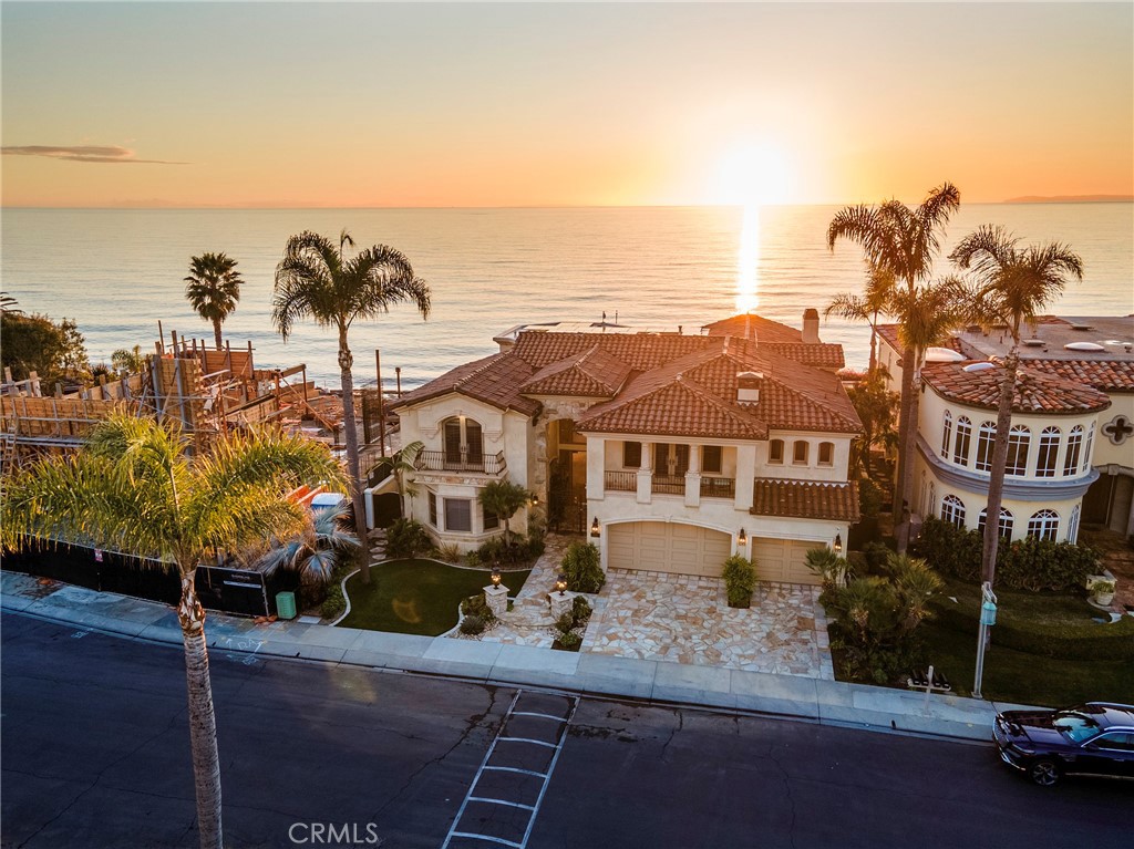 Perched on a breathtaking oceanfront bluff in the prestigious guard-gated community of Cyprus Cove, 3824 Vista Blanca is a one-of-a-kind coastal estate. Built in 2002 on 42 deep-set caissons with partial concrete construction, this architectural masterpiece offers unparalleled stability and longevity on the bluff. Spanning nearly 7,000 sq. ft. of exquisitely designed living space on a 13,068 sq. ft. homesite with 70 feet of prime ocean frontage, this residence is a true trophy on the Pacific. Luxury amenities abound, including private beach access, a state-of-the-art theater, a temperature-controlled wine cellar, and uninterrupted panoramic views stretching from Dana Point to San Diego. Offered at $12.9 million, this estate presents an extraordinary value at just over $1,800 per square foot—a remarkable opportunity compared to Newport Beach’s oceanfront properties averaging nearly $3,000 per square foot and Los Angeles County’s ultra-exclusive coastal homes exceeding $4,500 per square foot. Ideally positioned between San Diego and Los Angeles International Airports, with convenient access to John Wayne Airport and Carlsbad’s private aviation facilities, this exceptional residence offers effortless accessibility for discerning buyers seeking an iconic California retreat.**There will be no scheduled open houses for this property. Private tours for qualified buyers only. The seller is offering owner financing at a competitive 5% interest rate for qualified buyers.**