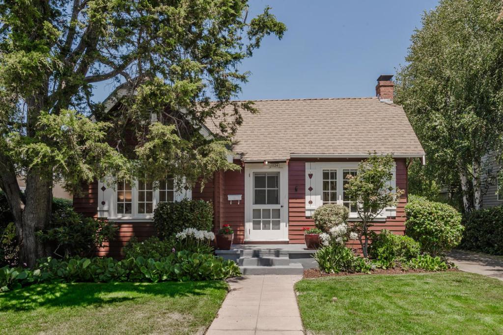 Located in Burlingame's coveted Easton Addition neighborhood, this storybook 2BD/1BA home offers timeless appeal, thoughtful updates, and incredible potential. Highlights include a formal living room with classic fireplace, a bright dining room with French doors, and a sunny kitchen with granite countertops, stainless steel appliances, and a bonus room perfect for a home office or creative space. Set on a generous 6,000 sq ft lot, the backyard is ideal for entertaining or expansion, and the detached garage offers ADU potential. With newly refinished hardwood floors and a classic layout, this home is charming as-is, full of potential, and ready for its next chapter. Walkable access to top-rated schools, shops, parks, and transit options including CalTrain, BART, and major freeways.